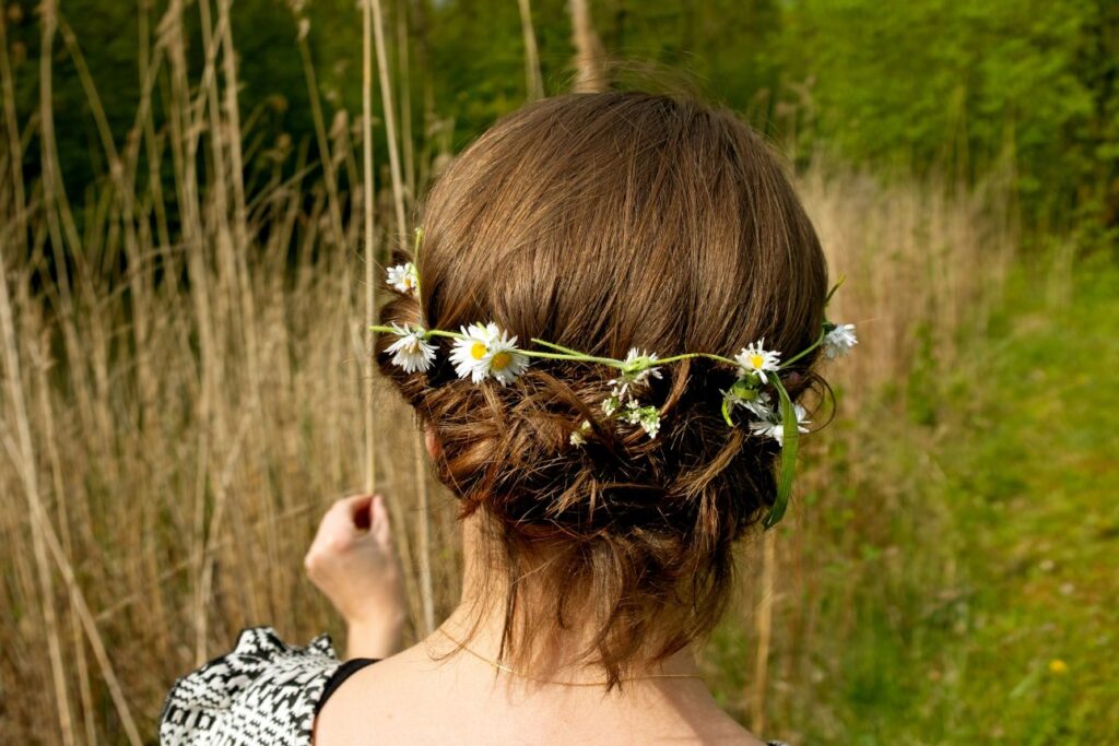 Woman wearing a handmade flower crown during Swedish Midsummer celebration